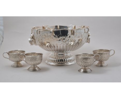 Plated punch bowl, with nine punch cups attached and four others, diameter 32cm.