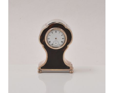 Silver and tortoiseshell faced dressing table clock, Birmingham 1920, balloon shape, white enamel dial, Swiss movement, 12cm.