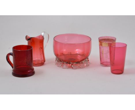 Cranberry glass basin, diameter 13cm, Cranberry glass jug, beaker and two other items of coloured glass, (5).