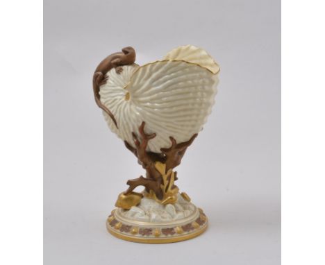 Royal Worcester conch shape bowl, 1986, modelled with a lizard, coral formed base, restored, 22cm.