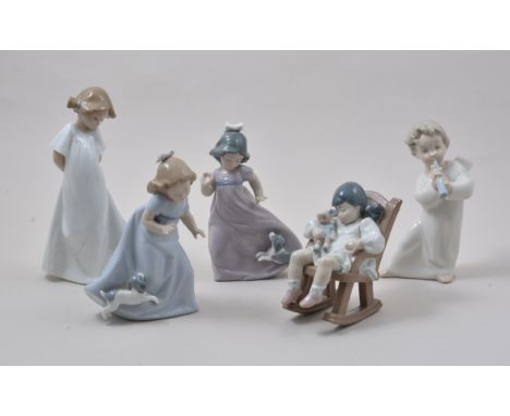 Lladro model of Girl Sleeping in a Rocking Chair, 12cm, a Lladro model of child angel and three Nao figures, (5).