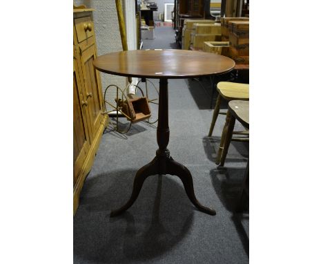 Victorian mahogany pedestal table, circular tilt top, slender baluster column on tripod legs.