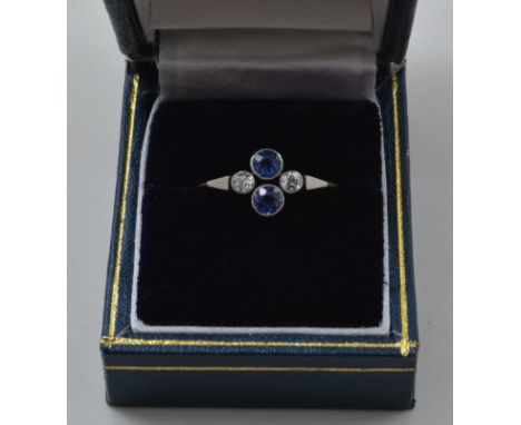 Yellow and white gold diamond and sapphire ring, set with two sapphires and two diamonds.