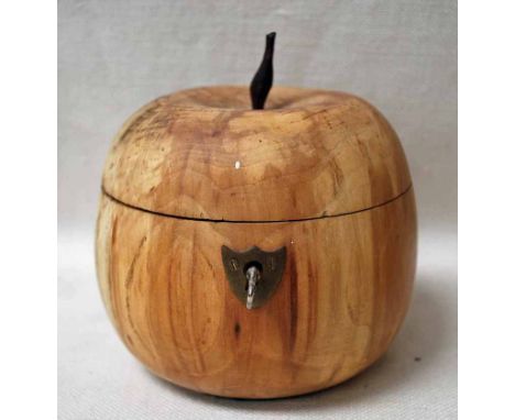 A large Fruit Wood Tea Caddy of typical apple shape with hinged cover, escutcheon and key, 13cm diameter by 14cm high includi