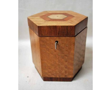 An inlaid mahogany and walnut Tea Caddy of hexagonal form, the string and marquetry inlaid hinged lid opens to reveal an inne