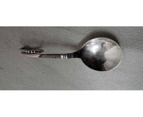 A mid-20th century Georg Jensen silver ornamental Caddy Spoon, circular bowl, beaded looped terminal, pattern 41, import mark