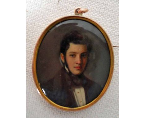 A late 19th century Memorial Portrait Miniature, depicting Theodor Goldstuker, in a yellow metal locket frame with brooch pin