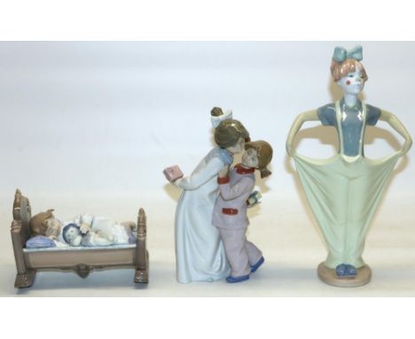 Lladro figure #5717 Rock-a-Bye Baby, H12cm, and two Nao figures including Clowning Ready, H29cm (3) 