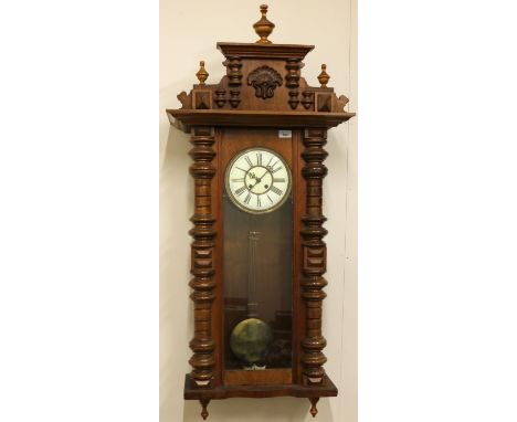 Early C20th walnut and beech stained Vienna style wall clock, carved and moulded pediment over fully glazed panelled door wit