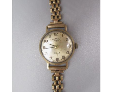 Rotary women's 9ct gold cased wristwatch, with signed silver dial, two piece case on 9ct gold gate style bracelet, case back 