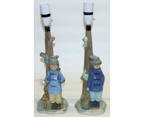 Two Nao table lamp bases modelled as children under trees, H38.5cm (2) 