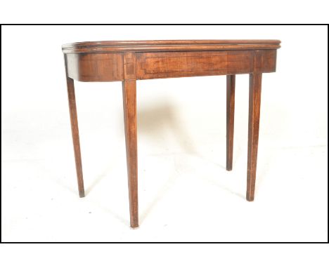 A 19th Century Georgian mahogany line inlay demi lune fold over tea / card games table raised on&nbsp; square tapering&nbsp; 