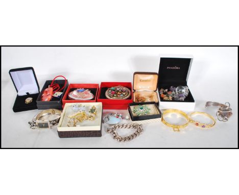A collection of contemporary costume jewellery to include a selection of agate bracelets, a group of three enamelled scottie 