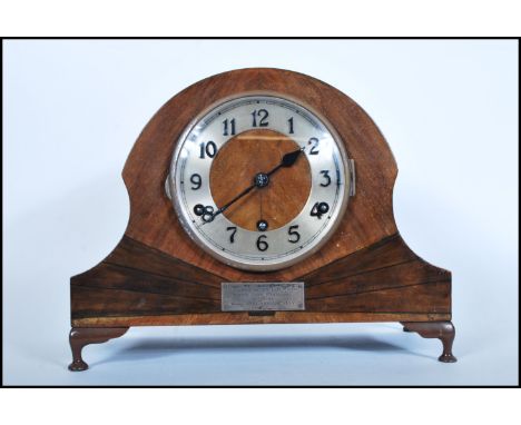 A early 20th Century Art Deco Napoleon hat oak case mantel clock having silverd dial with Arabic numerals to chapter ring beh