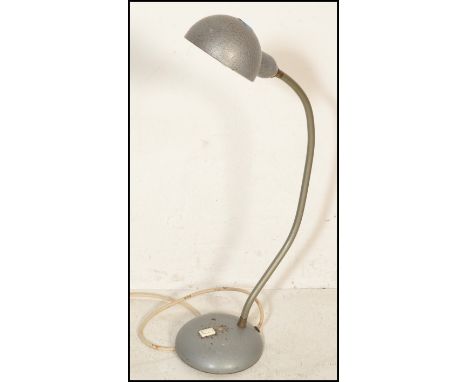 A vintage industrial mid 20th Century factory / office desk work lamp, circular base with gooseneck adjustable upright termin