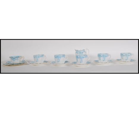 A late 19th / early 20th Century Victorian part tea service by Wileman Foley (Early Shelley)&nbsp; having blue floral swags w