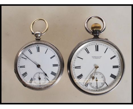 A late 19th Century silver hallmarked open face pocket watch having white enamel face with Roman numeral chapter ring, facete