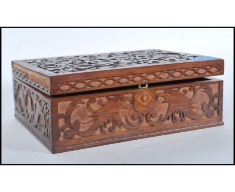 A 19th Century Victorian fretwork work box having a variety of vintage curios to the inner to include WWI trench art items, s