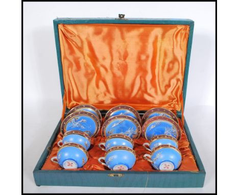 A 1920's Japanese boxed tea service. Complete in the original presentation case complete with 6 cups and saucers decorated in