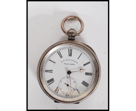 An early 20th century silver cased pocket watch by Henry E Peck Swiss made. The white enamel face with Roman numeral chapter 