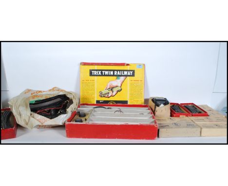 A vintage mid 20th Century boxed Trix Twin Railway to include tinplate engines, carriages, track etc.&nbsp;