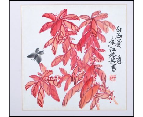 After Qi Baishi. A mid 20th Century Chinese watercolor on paper of red maple leaves having a singular butterfly in flight. Fr