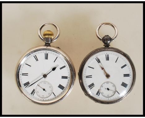 Two silver hallmarked open face pocket watches, both having white enamel face with Roman numeral chapter ring, faceted hands 