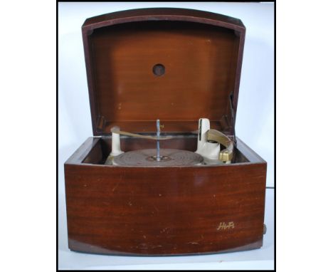 A 1950's mid century walnut cased Pye Black Box record player. The hinged top opening to reveal record deck. Marked Pye to th