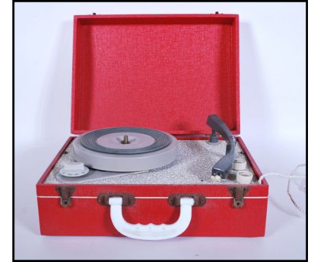A vintage 20th Century circa 1960's portable record player in the form of a suitcase, lift up top which also contains the spe
