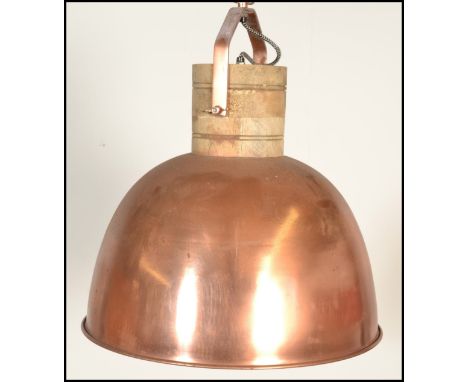 A vintage 20th Century industrial copper pendant ceiling light of domed form, having a black and white woven chord. Measures: