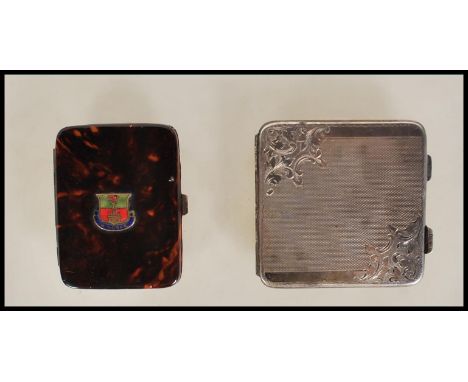 A silver continental compact of square form having engine turned decoration to front and verso, hinged opening to reveal mirr
