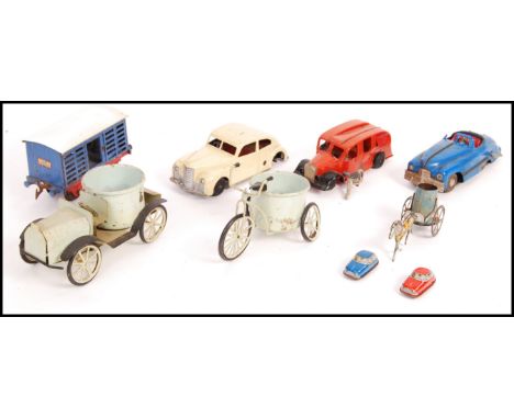 A collection of assorted original vintage toys to include: tinplate clockwork windup cars, Mettoy, Triang Minic fire engine a