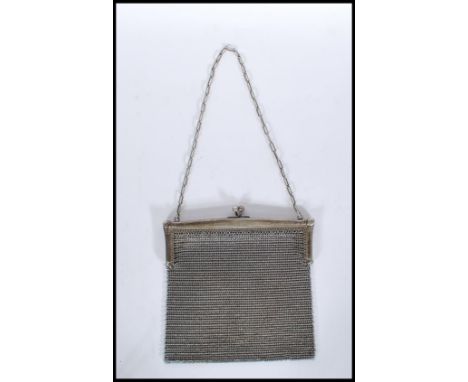 A 20th Century vintage silver mesh purse / bag having ball clasp to the top on a chain strap. Unmarked but tests as silver. W