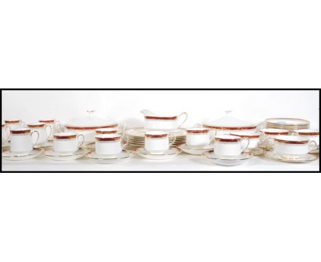 An extensive Royal Albert dinner service in the Holyrood pattern consisting of six dinner plates, six tea plates, eight tea c