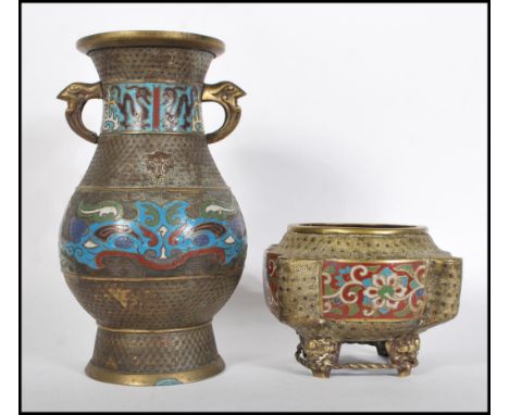 A 20th Century Chinese brass oriental vase of bulbous form having twin handle atop with enamel decoration depicting dragons, 