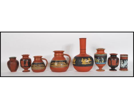 A collection of late 19th Century Terracotta Prattware consisting of; a Pratt ware Jug with polychrome banding with a Greek k