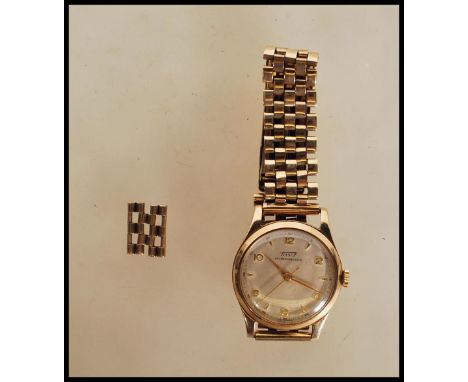 A hallmarked 9ct gold vintage Swiss sixteen jewel Tissot Antimagnetique gents wrist watch, having a signed silvered dial with