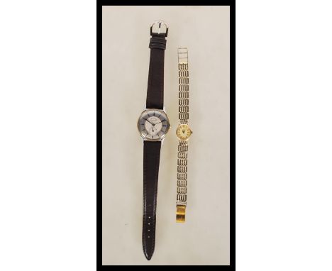 A vintage Rotary watch having a silver strap with an oval face and cream dial with baton markings to the chapter ring togethe