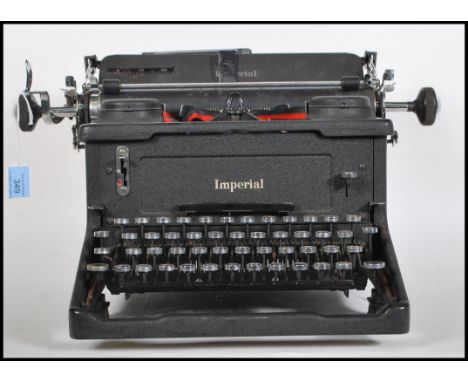 An early 20th century vintage industrial manual typewriter by Imperial, having an A3 roller and marks to back.&nbsp;