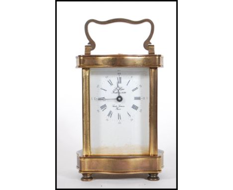 A 20th Century French Gilt Brass Carriage Clock By L`Epee, The enamel dial with Roman &amp; arabic numerals. The dial marked&