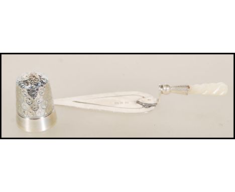 A Victorian silver hallmarked bookmark in the form of a trowel (hallmarked Birmingham 1897) along with a silver hallmarked th