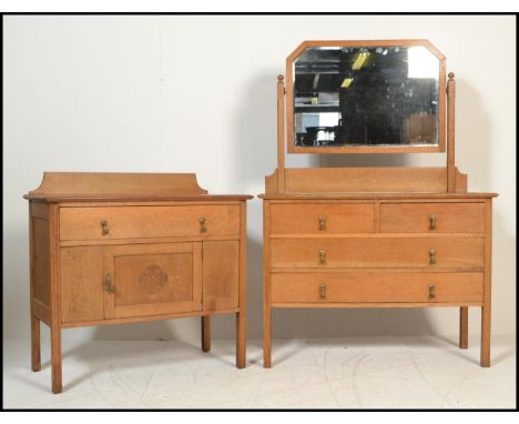 A late 19th / early 20th Century high Victorian light oak dressing chest having large swing mirror (with foxing) above two sh