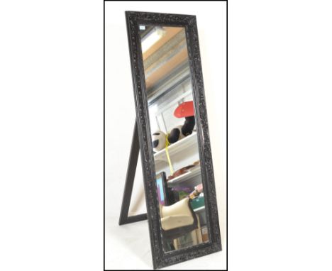 A large freestanding bedroom antique style Versailles type easel mirror. Full size with carved cushion frame housing bevelled