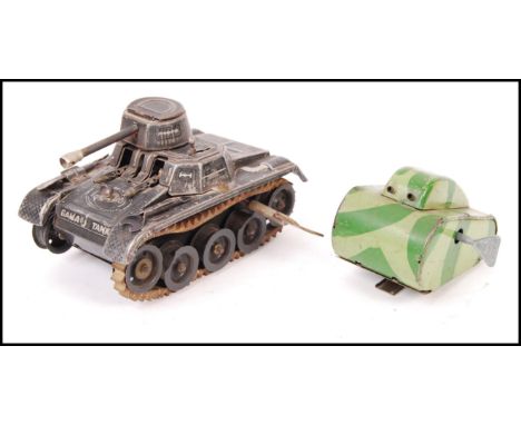 Two original vintage clockwork tinplate windup toys. Comprising Gama Tank and a smaller green tinplate example with standing 