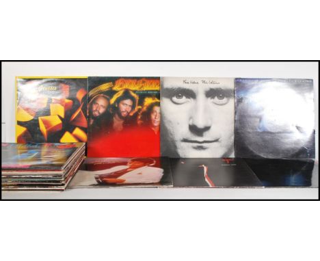 A collection of vinyl long play LP vinyl record albums from various artists to include Fleetwood Mac, Electric Light Orchestr