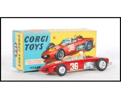 An original vintage Corgi Toys made boxed diecast model No. 154 ' Ferrari Formula 1 Grand Prix Racing Car '. Red, with driver