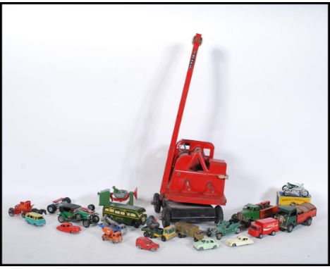 A collection of assorted vintage diecast model vehicles to include two clockwork Tri-Ang Minic trucks, clockwork Green Line b