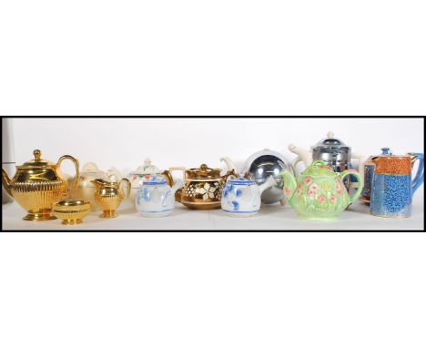 A collection of teapots dating from the early 20th Century to include an example by Clarice Cliff, Chinese, Staffordshire, To