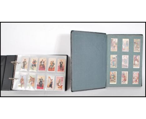 A collection of vintage cigarette cards across two albums to include full and parts sets; Ringer's cigarettes Musical Instrum