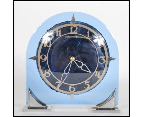 A early 20th Century Art Deco blue glass and chrome mantel clock having pierced Arabic numeral chapter ring, raised in two ch